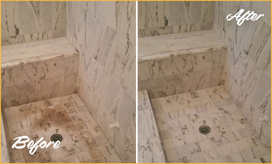Before and After Picture of a Dirty Nassau Marble Shower Cleaned to Eliminate Dark Stains